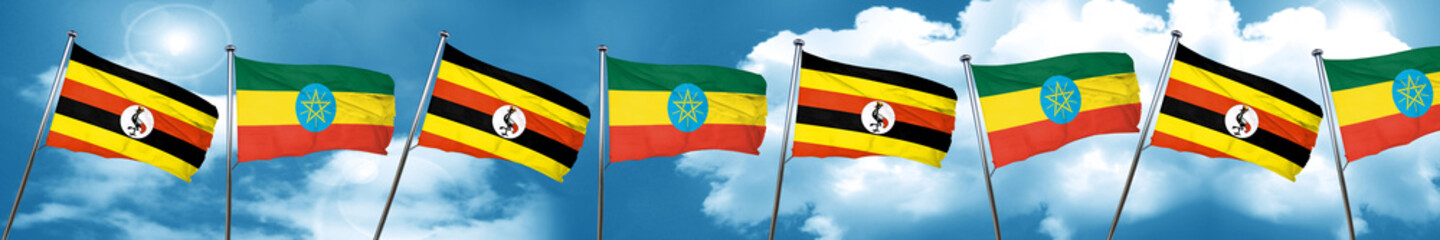 Uganda flag with Ethiopia flag, 3D rendering
