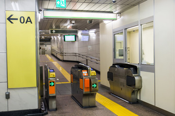 entrance with turnstile to the subway station