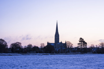 Fototapeta na wymiar Salisbury cathedral and the West Harnham water meadows in Winter.