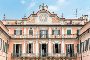 Estense Palace (Palazzo Estense) facade with a sundial, topped by estense Eagle, Varese, Italy
