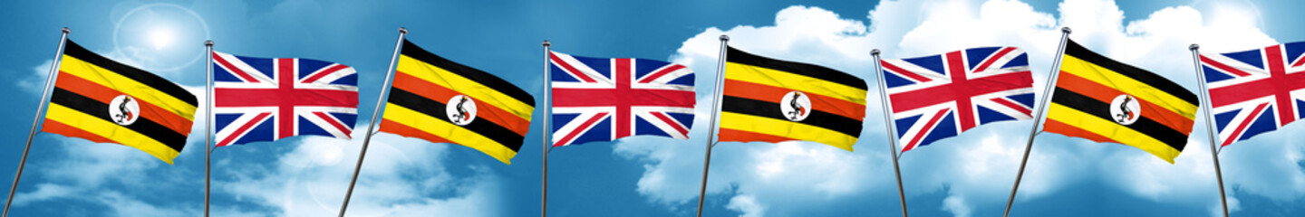 Uganda flag with Great Britain flag, 3D rendering
