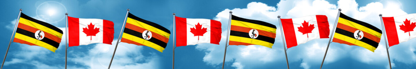 Uganda flag with Canada flag, 3D rendering