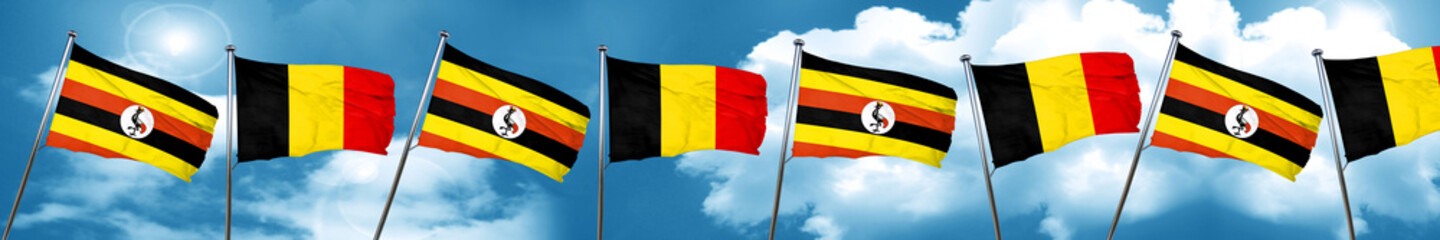 Uganda flag with Belgium flag, 3D rendering