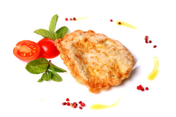 Chop decorated with mint leaves and cherry tomato