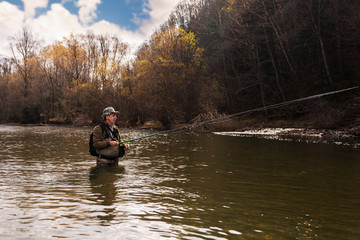 Fototapeta na wymiar Grayling fishing on mountain river