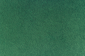 Fototapeta premium emerald background. Decorative external plaster. Exterior finis