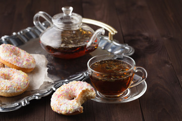 Fresh donuts for breakfast with tea