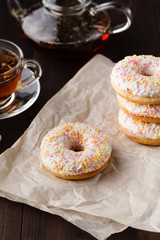 Tea for breakfast with fresh pastry donuts