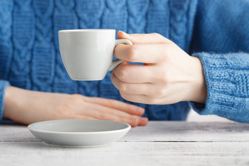girl drink espresso coffe from small cup