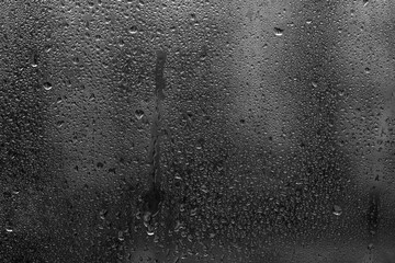 drops on glass , monochrome background