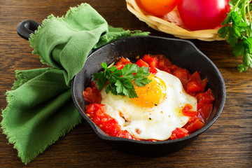 Scrambled eggs with roasted tomatoes.