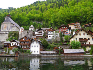 Scenic Traditional Waterfront Houses and Church on the Hallstatt Lake Shore, Austria 