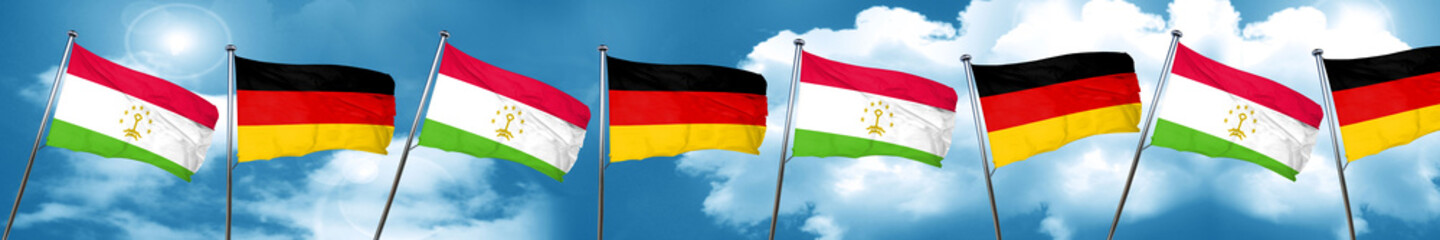 Tajikistan flag with Germany flag, 3D rendering