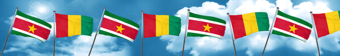 Fototapeta na wymiar Suriname flag with Guinea flag, 3D rendering