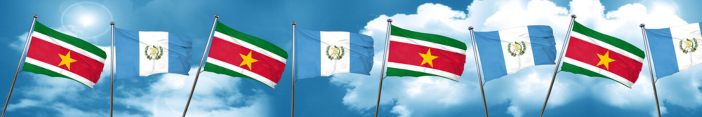 Suriname flag with Guatemala flag, 3D rendering
