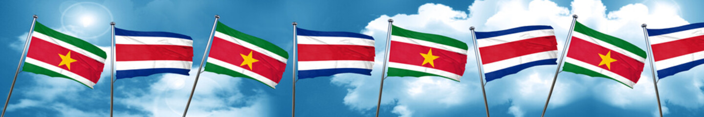 Suriname flag with Costa Rica flag, 3D rendering