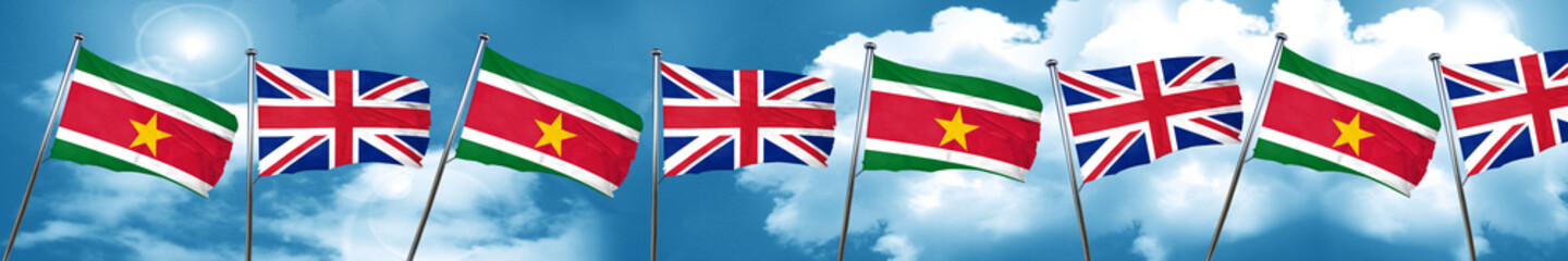 Fototapeta na wymiar Suriname flag with Great Britain flag, 3D rendering
