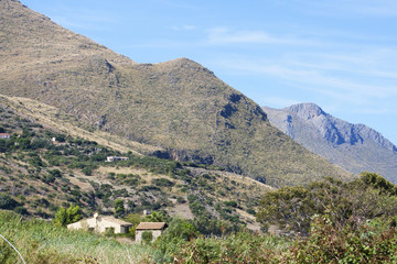Fototapeta na wymiar View from Scopello Village into the mountains and vegetation near the coast, Sicily, Italy