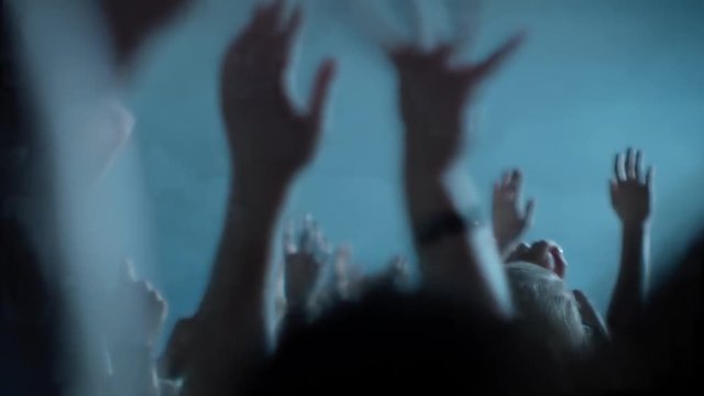 Hands in the air at a music festival - view from audience perspective