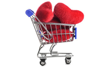 Shopping cart full of hearts for Valentine's Day on white background