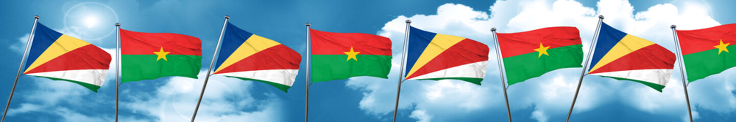 seychelles flag with Burkina Faso flag, 3D rendering