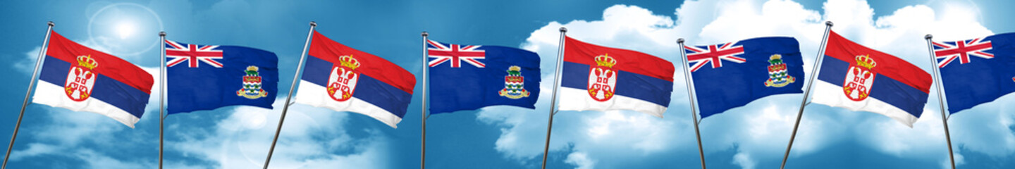 Serbia flag with Cayman islands flag, 3D rendering