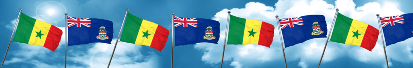 Senegal flag with Cayman islands flag, 3D rendering