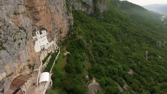 Aerial camera review of Ostroska Greda with upper Serbian Orthodox monastery of Ostrog and Bjelopavlici plain, Montenegro

