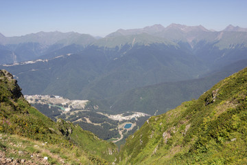 Fototapeta premium The view of the summer mountains in the vicinity of the ski resort Rosa Khutor. Russia