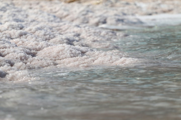 Fototapeta na wymiar Dead Sea salt stones at the Dead Sea