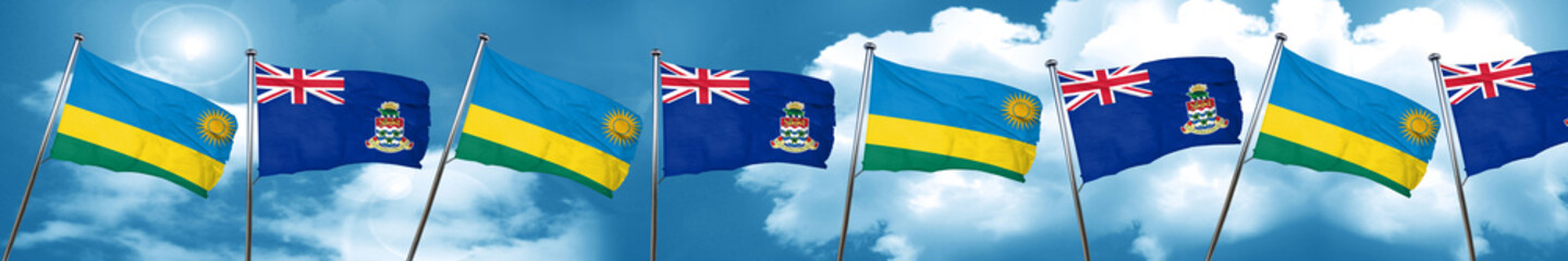 Rwanda flag with Cayman islands flag, 3D rendering
