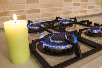 Closeup shot of blue fire from domestic kitchen stove. Gas cooke