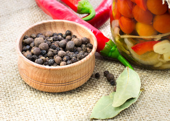 canned tomatoes with spices and chili on the tablecloth from bur