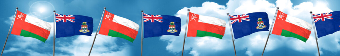 Fototapeta na wymiar Oman flag with Cayman islands flag, 3D rendering