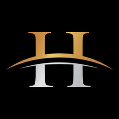 initial letter logo with swoosh silver gold