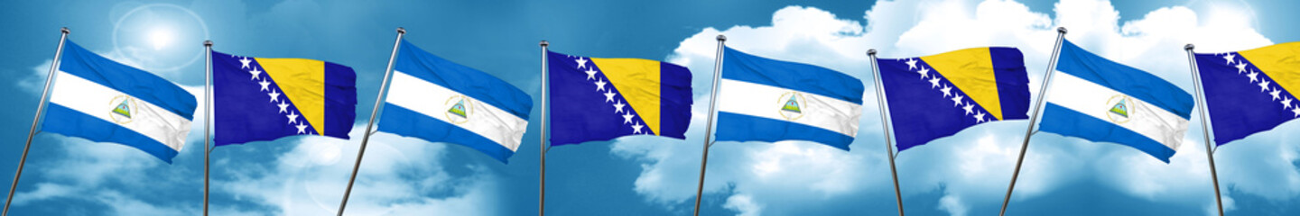 nicaragua flag with Bosnia and Herzegovina flag, 3D rendering