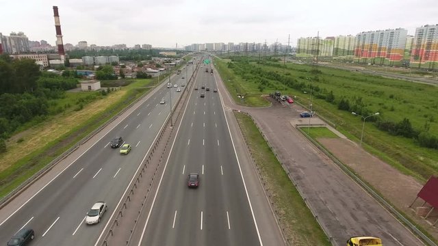 Traffic at the city ring highway. Camera flying across road. St. Petersburg, Russia
