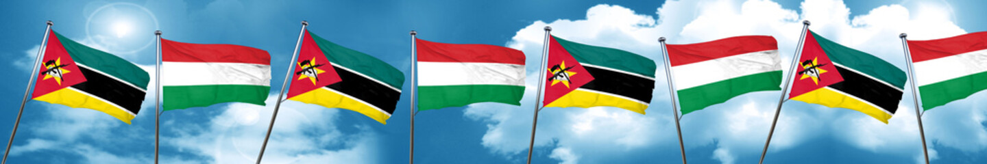 Fototapeta na wymiar Mozambique flag with Hungary flag, 3D rendering