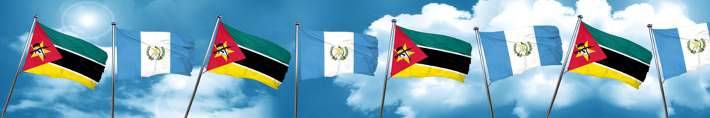 Mozambique flag with Guatemala flag, 3D rendering