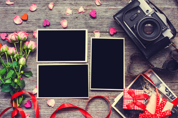 valentines day background. blank photo frames with retro camera