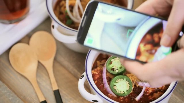 Taking pictures with smart phone of homemade turkey chili