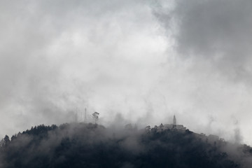 Monserrate covered in fog in downtown Bogota, Colombia.