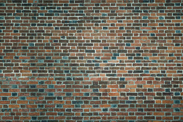 Old wall of red briks. Wallpaper of ordinary building wall texture.
