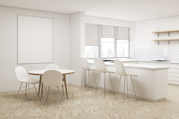 Corner of white kitchen with round table