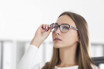 Front view of blond businesswoman in glasses