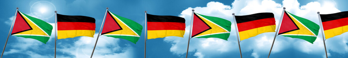 Guyana flag with Germany flag, 3D rendering