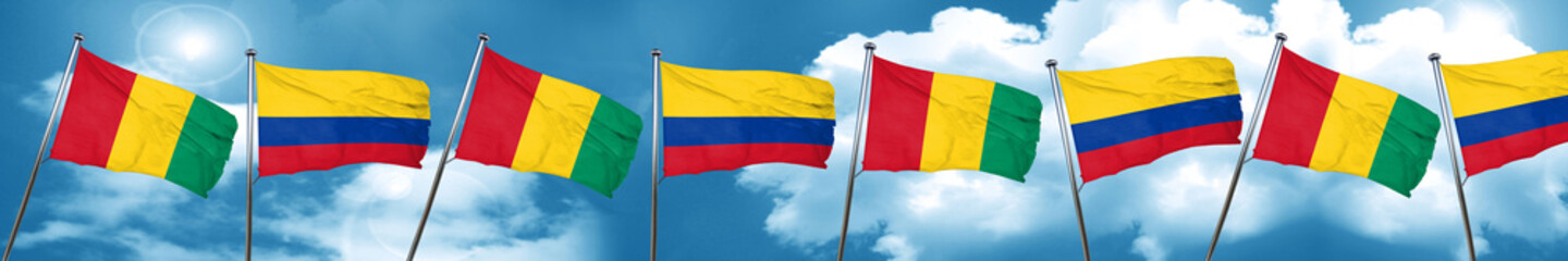 Guinea flag with Colombia flag, 3D rendering