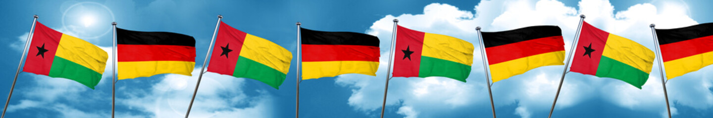 Guinea bissau flag with Germany flag, 3D rendering
