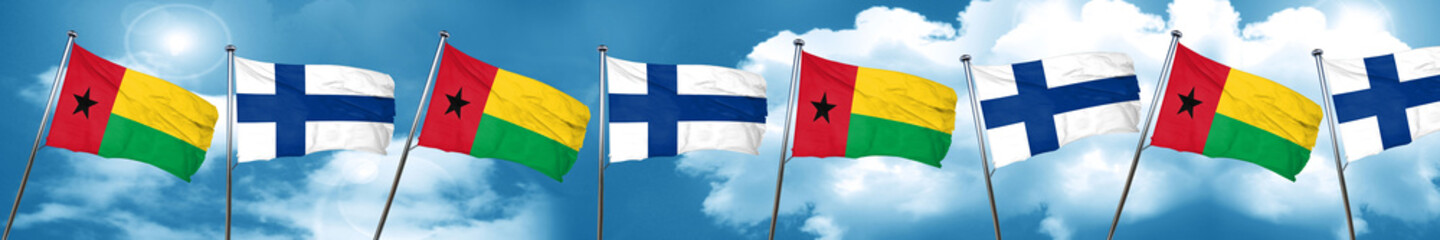 Fototapeta na wymiar Guinea bissau flag with Finland flag, 3D rendering
