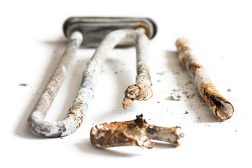 Damaged Heating Element of the Washing Machine on White Background.